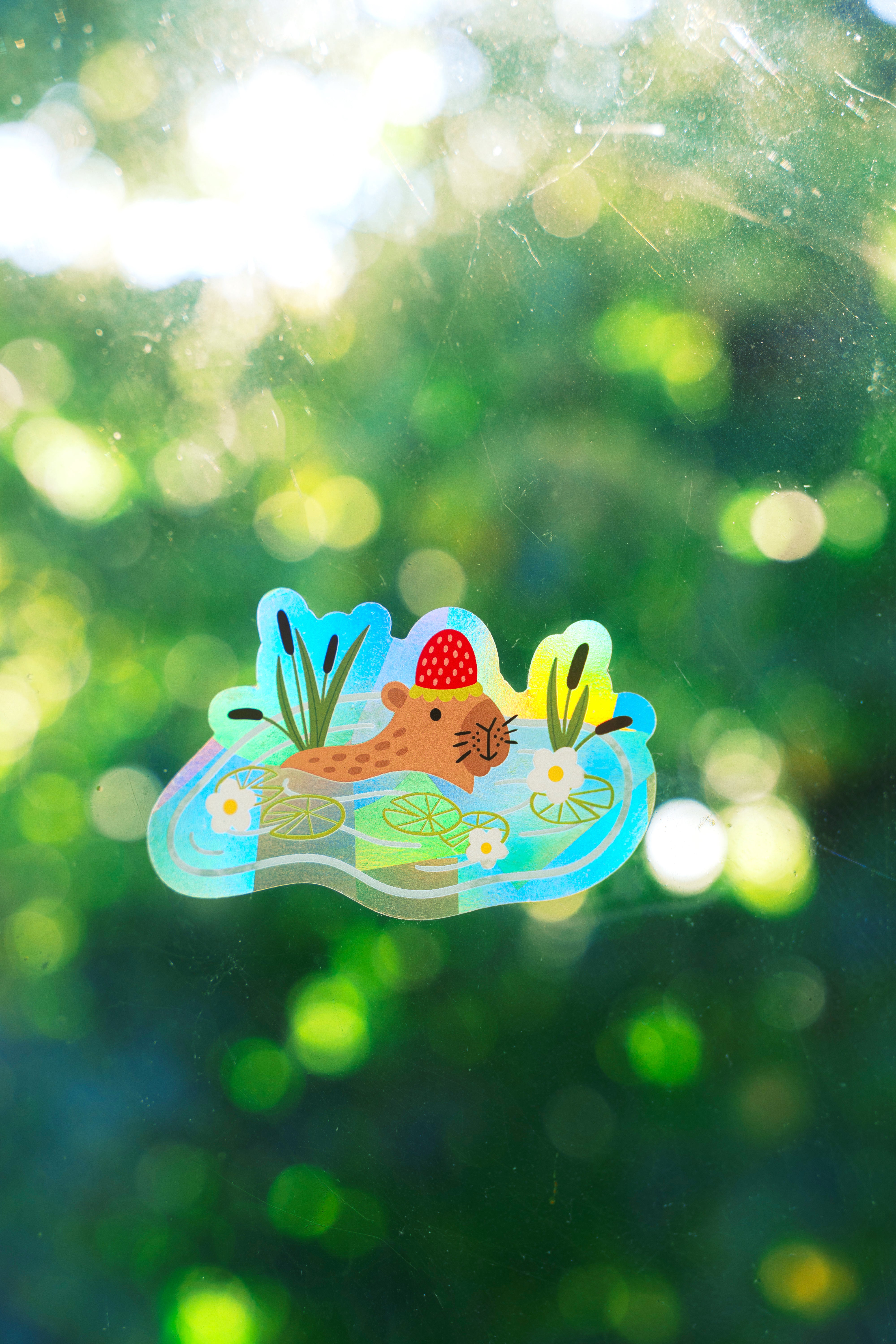 Strawberry Capybara Suncatcher Sticker – Prismatic Window Cling | Rainbow Maker Decal